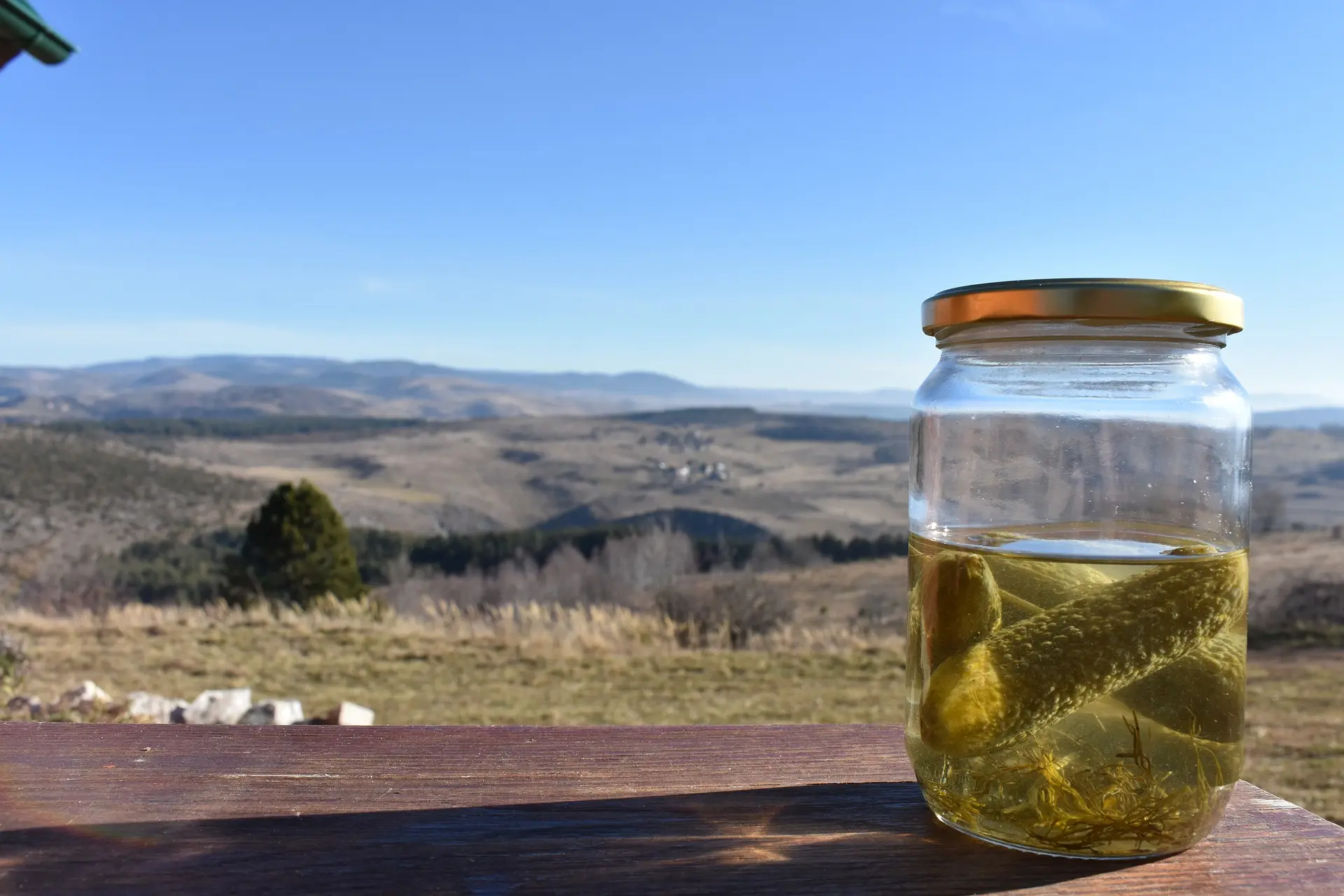 Pickels on a glass container.